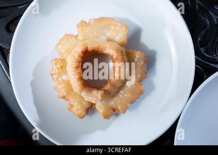A top down view of an old-fashioned donut on a plate. Stock Photo
