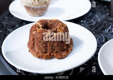 A view of a small banana nut bundt cake on a plate. Stock Photo