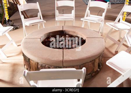 A view of an urban design gas-powered fire pit. Stock Photo