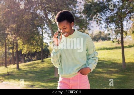 young african american woman talking on phone Stock Photo