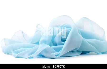 Transparent light blue fabric draped in waves on white background Stock Photo