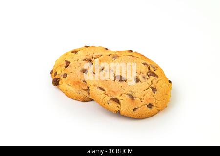 Two chocolate chip cookies on a white background. The cookies are placed next to each other and appear to be freshly baked Stock Photo