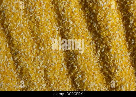 Abstract Yellow Cooking Corn Grits Background Stock Photo