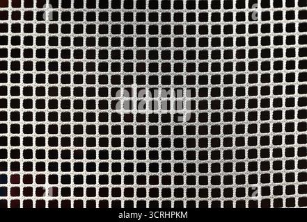 White mesh on black background, cellular grid pattern with geometric texture, close up Stock Photo