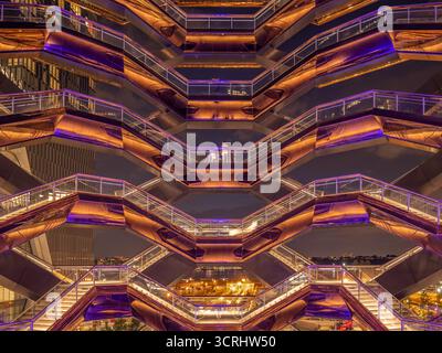 Modern Geometric Architecture with Illuminated Staircases and Abstract Symmetry in Futuristic Urban Night Scene Stock Photo