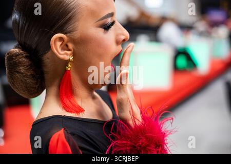 young dancer yawns in anticipation of a competition Stock Photo