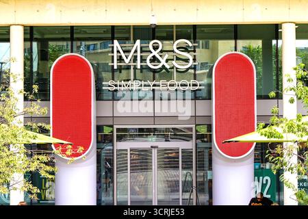 London, England, UK - 4 July 2024: Front exterior view of the entrance to a Marks and Spencer food hall store in the Paddington area of central London Stock Photo
