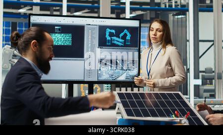 Scientists conduct experiments on PV materials to improve solar panel efficiency. Photovoltaics factory research and development department experts working on renewable energy solutions, camera B Stock Photo