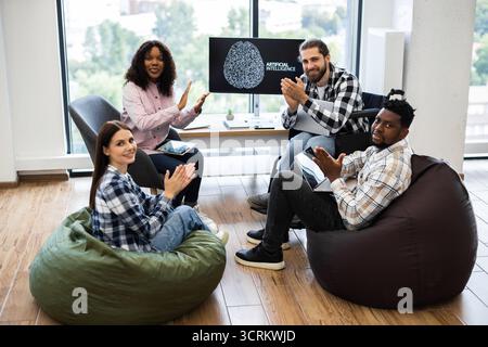 Team of professionals collaborating on artificial intelligence project Stock Photo