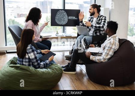 Team collaborating on artificial intelligence project in modern office setting Stock Photo