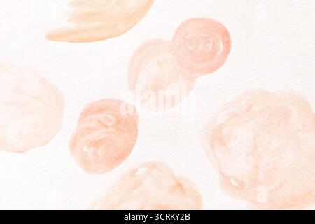 Abstract watercolor painting with soft peach and pink circular shapes on white background. Stock Photo