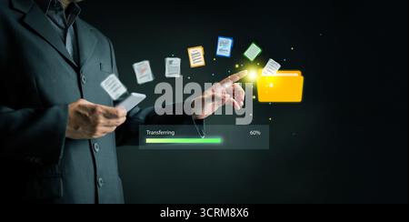 Digital file transfer concept with businessman hand touching folder icon, symbolizing cloud storage, mobile connection, online communication, and secu Stock Photo