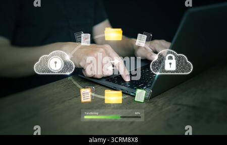 Business concept of data protection and cloud computing, showing secure file sharing, cybersecurity, laptop use, online storage, and digital technolog Stock Photo