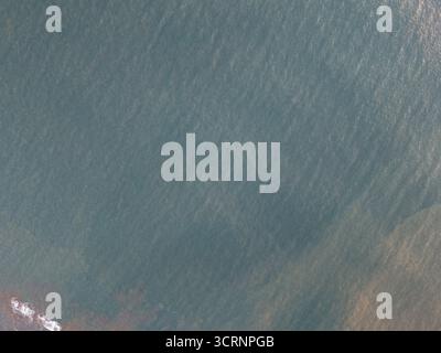 Green ocean pacific shore above top view background Stock Photo