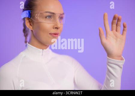 Woman Using Futuristic Augmented Reality Glasses Stock Photo