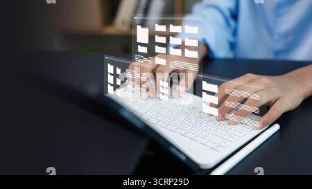 Close-up of hands typing on keyboard with digital file folder interface, cloud storage, and data management technology concept for business and IT sol Stock Photo