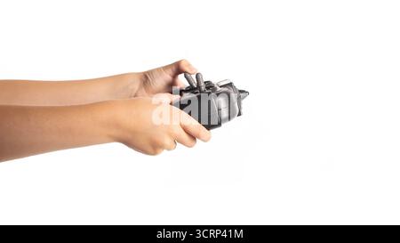 Black joystick for gaming in children's hands on a white background, isolate Stock Photo
