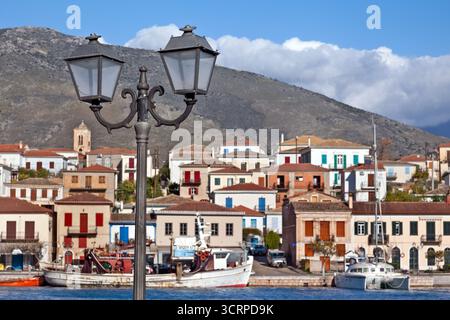Galaksidi town, panoramic view of the old, traditional town in central Greece at the background, with an old, rusty lamp post in the foreground. Stock Photo