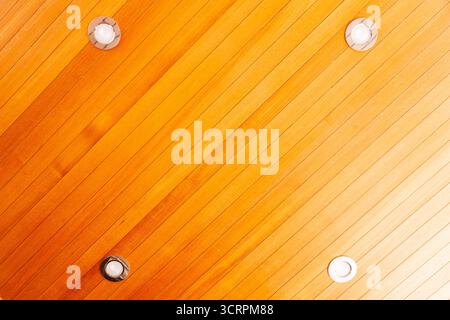 Wooden ceiling with built in ceiling spotlights. Stock Photo
