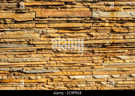 The wall was built with sandstone blocks in Brazil. stone texture, abstraction, background, material for finishing of buildings and premises Stock Photo