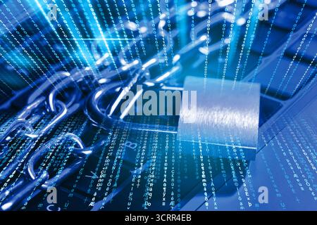 Padlock with chain on laptop, toned in blue. Programming codes. Cyber security Stock Photo