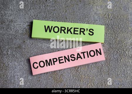 Concept of Workers Compensation write on sticky notes isolated on ...