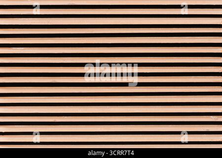 Horizontal metal slats texture background. Industrial striped pattern with geometric lines and modern architectural surface detail closeup. Stock Photo