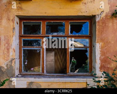 Broken window. Consequences of attack or disaster. Stock Photo
