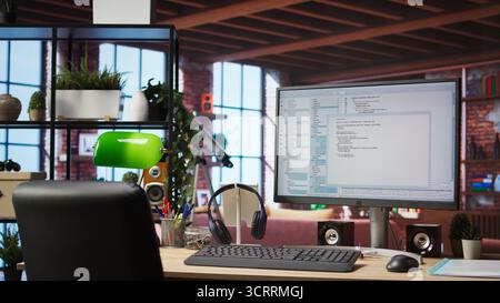 UI on PC screen in home office with programming code being executed. Coding application UI used by IT programmers to write and test code in modern apartment, panning shot Stock Photo