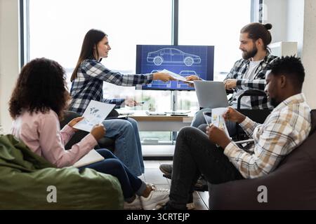 Team brainstorming to develop car design in a modern office space Stock Photo