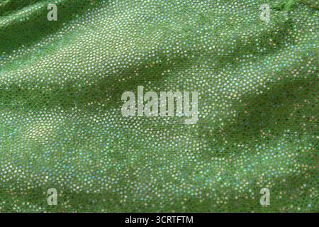 Close up textured background of green sparkles fabric material Stock Photo