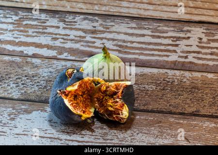 fresh figs on rustic wooden surface Stock Photo