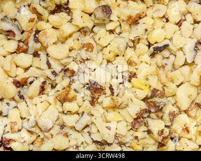 Chopped walnut kernels. Walnut background Stock Photo
