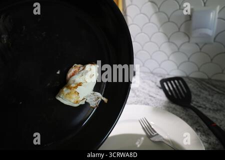 Fried Egg in Black Skillet Over Countertop Stock Photo