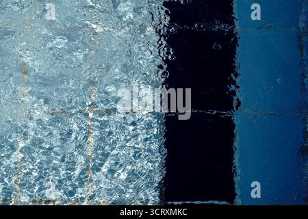 Agitated water ripples in a swimming pool Stock Photo