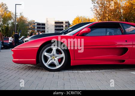 Vilnius, Lithuania - 2025-09-20 - Iconic vintage Ferrari 355 F1 Berlinetta photographed from the side. Retro Italian Sports Car Stock Photo