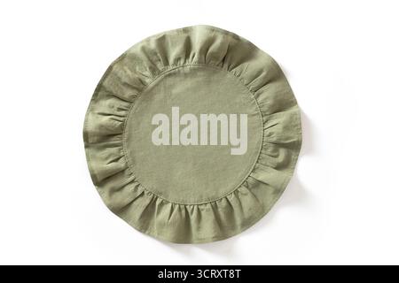 Cooking green round kitchen napkin or towel with ruffle isolated on white background. Top view. Stock Photo