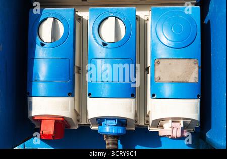 Three powerful protected high-voltage sockets. Stock Photo