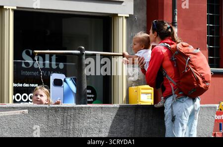 Mother and children playing with water fountain Basel  in northwestern Switzerland Stock Photo