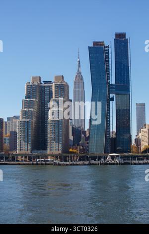 The American Copper Buildings and Empire State Building at sunset ...