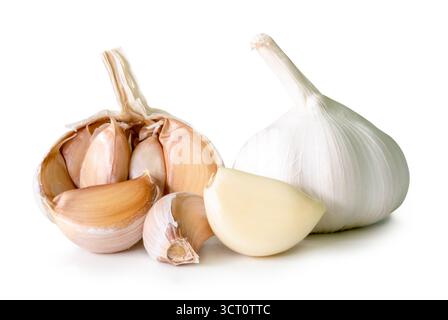 Side view of garlic bulbs with half and cloves in heap is isolated on white background with clipping path. Stock Photo