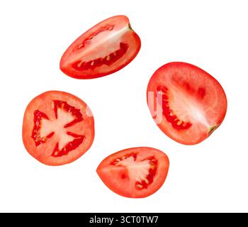 Top view set of ripe red tomato slices in halves and quarters is isolated on white background with clipping path. Stock Photo