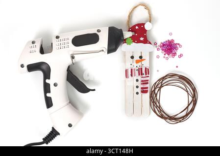 A Christmas flat lay showing the process of making homemade decorations. Craft supplies for a creative winter hobby. Perfect for holiday season concep Stock Photo