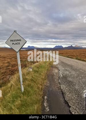 Passing place sign on remote single track road from Altandhu to Achiltibuie, Assynt—views to Suilven, Canisp, Cul Mòr and Stac Pollaidh, NC500. Stock Photo
