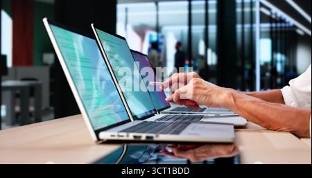 Developer Office: Coding And Developing Software On Computer Screens Stock Photo