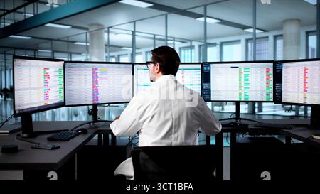 Senior Business Analyst Man Uses Computer To Manage Hospital Invoices. Stock Photo