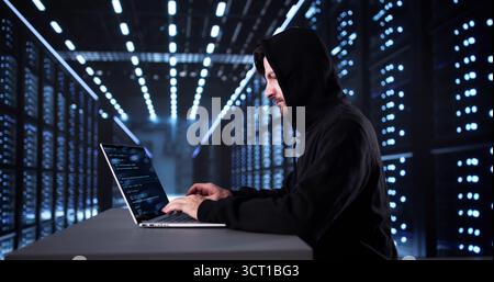 Old Man In Mask Hacking Cloud Server For Cyber Security Stock Photo