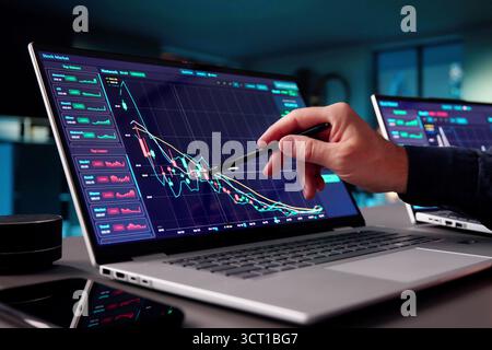 Senior Financial Analyst Working Late Hours In Trading Office. Stock Photo
