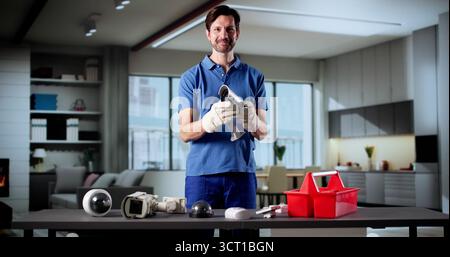 Elderly Technician Smiling While Installing Surveillance Security Camera System Stock Photo