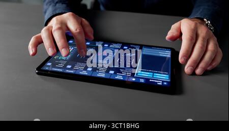 Businessman Analyzing Market Data With Analytic Dashboard On Computer Tablet Stock Photo